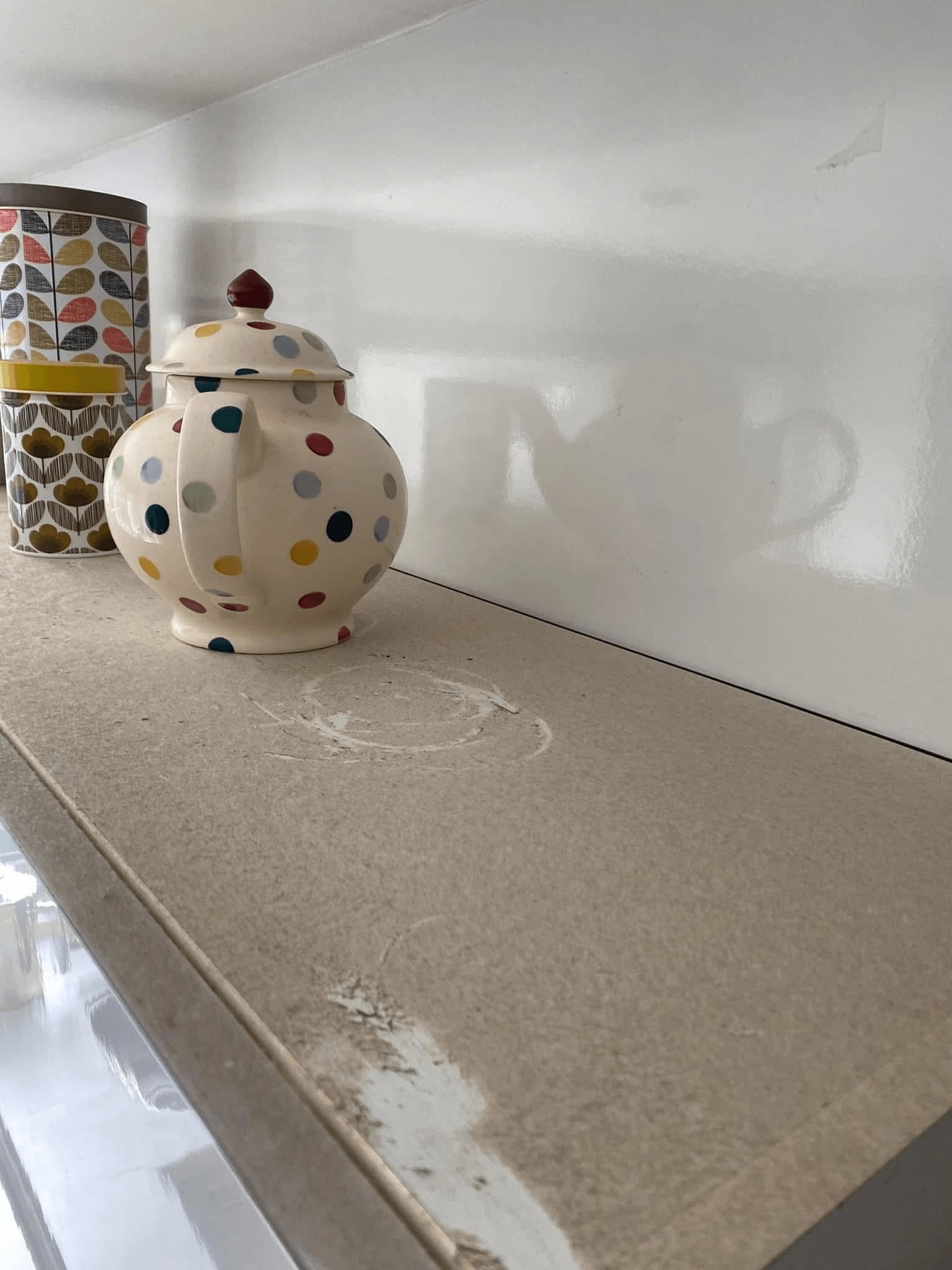 The top of a kitchen cupboard covered in dust